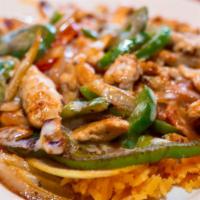 Pelusa Lunch · A lunch plate of Mexican rice topped with grilled chicken, peppers, corn, onions, tomatoes, ...