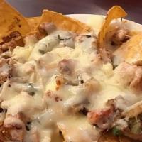 Special Fajita Nachos Lunch · Chips topped with steak or chicken cooked with bell peppers, onions and tomatoes, shredded c...
