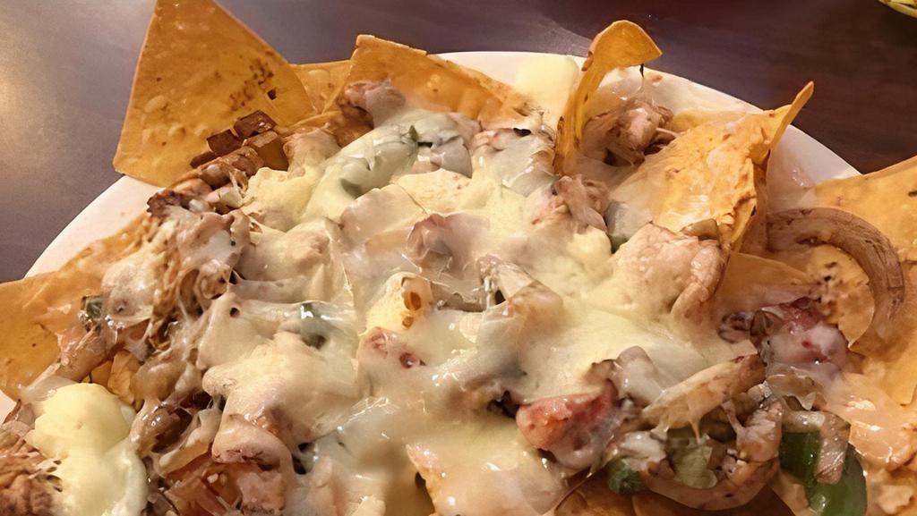 Special Fajita Nachos Lunch · Chips topped with steak or chicken cooked with bell peppers, onions and tomatoes, shredded cheese, and cheese dip.