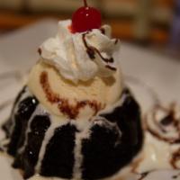 El Volcan · Warm chocolate cake with vanilla ice cream, topped with chocolate and caramel.