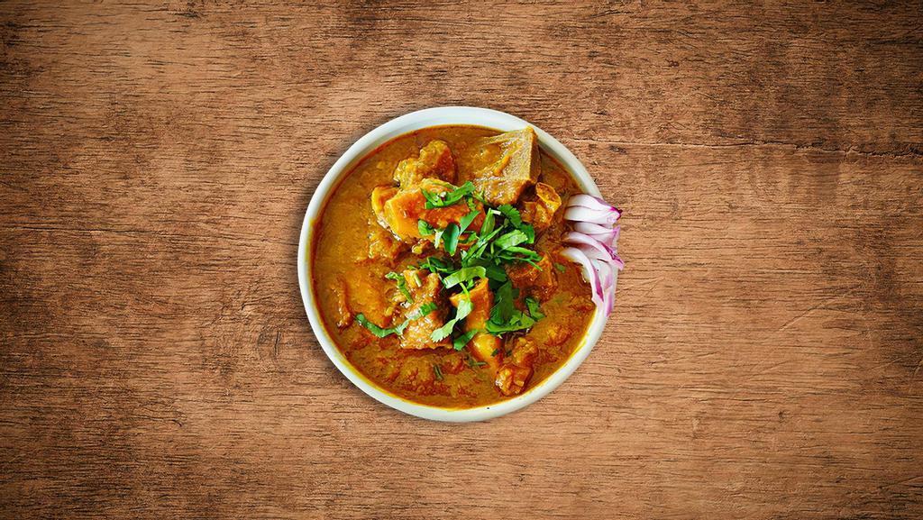United Goat Curry · Tender goat meat cooked slowly  with tomatoes, onions, fresh herbs and Indian spices.