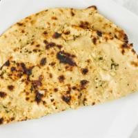 Garlic Naan · Gluten free. Topped with garlic and cilantro and then baked in tandoor. Wholesome breads fre...