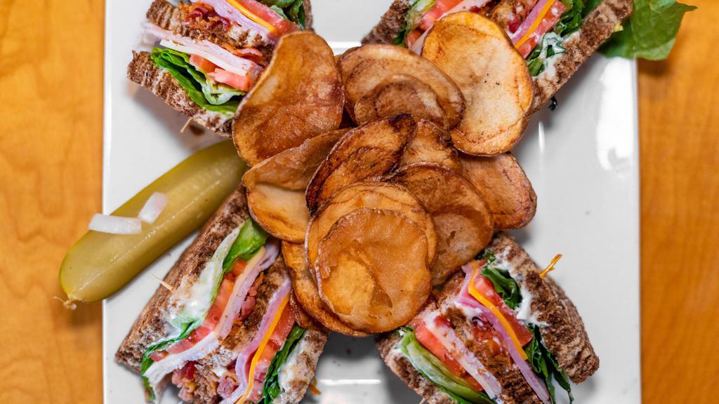 Classic Club · Turkey, ham, bacon, lettuce, tomato, cheddar, mayo stuffed between texas toast.