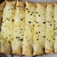 Cheesy Bread · Pie brushed with mix of extra virgin olive oil, oregano and garlic and topped with a generou...