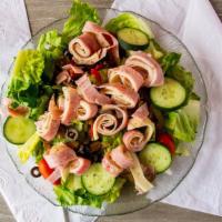 Chef'S Salad · Sliced turkey breast, ham, tossed over crisp lettuce with tomatoes, black olives, cucumbers,...