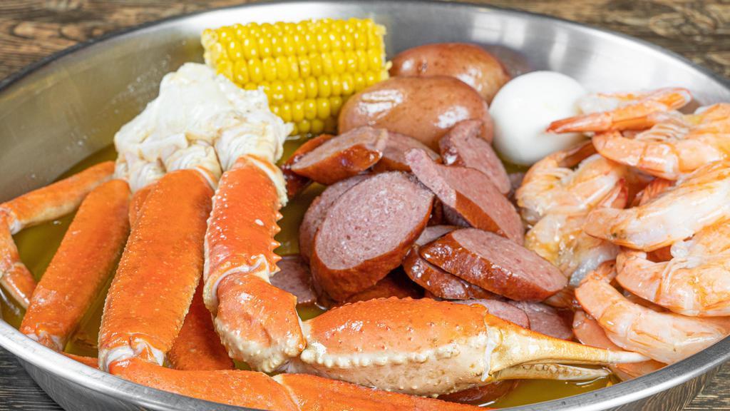 Signature Combo A · 1/2 lb crab legs, 1/2 lb shrimp, 1/2 lb sausage. Comes with one egg, one corn, and two potatoes.