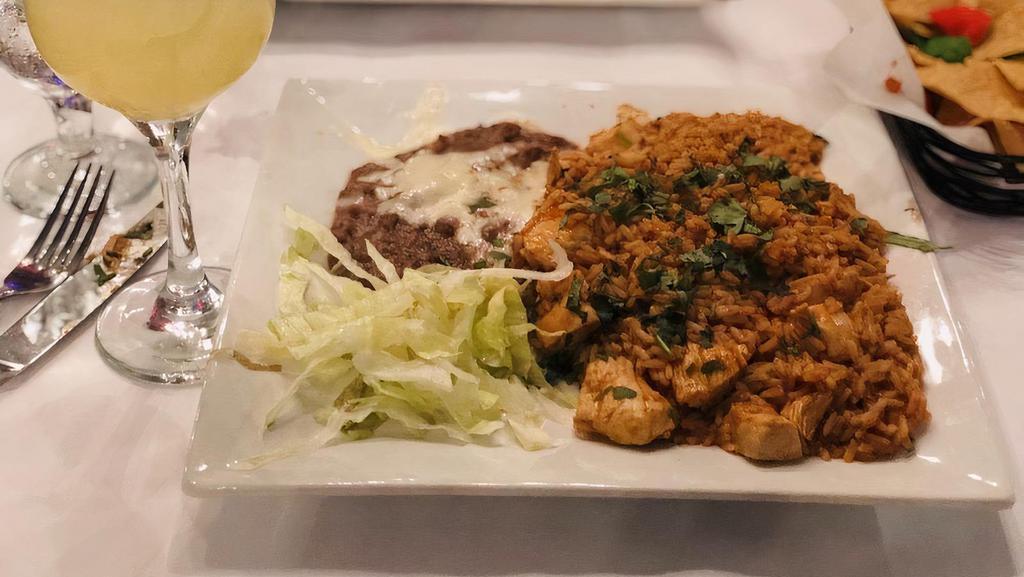 Pollo Margarita'S · Grilled chicken breast topped with shrimp and chorizo-cheese sauce. Served with guacamole, sour cream, pico de gallo, rice, beans and tortillas.