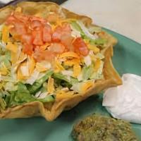 Fajita Taco Salad · A crisp flour tortilla with your choice of chicken or steak, sautéed onions, bell peppers an...