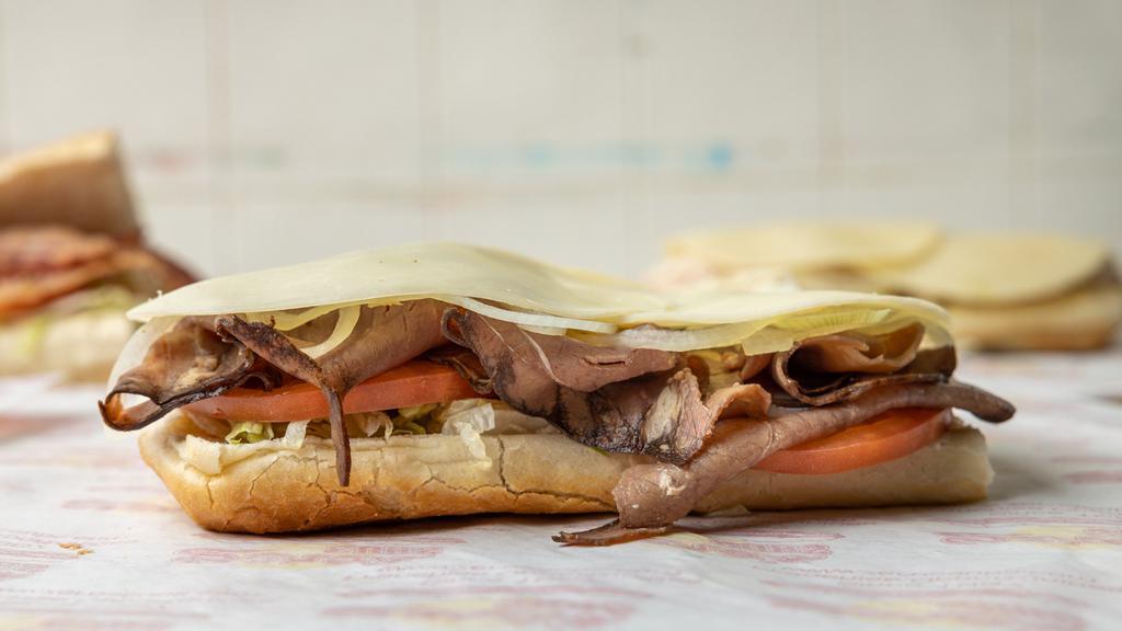 Roast Beef & Cheese Sub (Half) · Dressed with fresh provolone cheese, lettuce, tomato, onions, spices, oil, and vinegar.