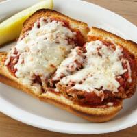 Eggplant Parmigiana · Breaded eggplant baked in our marinara sauce and topped with melted mozzarella cheese. Serve...