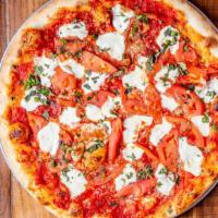 Margherita Pizza · A johnny Brusco's favorite. Light sauce topped with diced tomatoes, fresh basil and fresh mo...