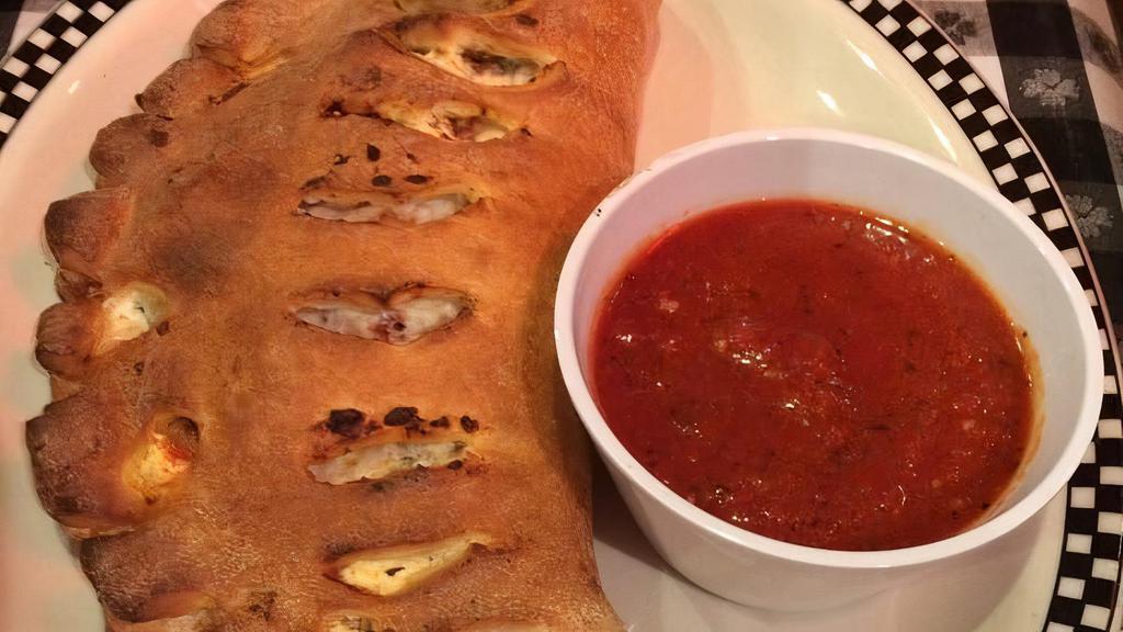 Vegetable Calzone · Spinach, red onions, roasted red peppers, mushroom.
