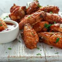 Bourbon Traditional Wings · Delicious crispy whole chicken wings deep-fried tossed with bourbon sauce.