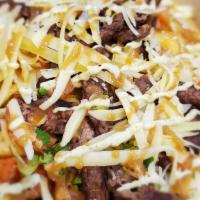 Loaded Steak · Grilled Steak, Pico de Gallo, Gouda Cheese, Cilantro Lime ranch, Pink Sauce, on a bed of Ste...