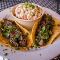 Steak Tacos Combo · Made with grilled steak, pickled onions, cilantro and chimichurri.