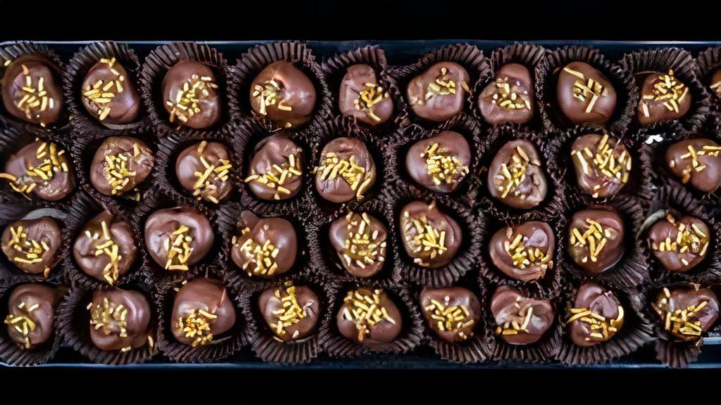 Bacon Bourbon Truffles - 6 Pieces · 1/2 dozen Bacon Bourbon Truffles - Chocolate ganache infused with Off Hours Bourbon, Bacon and dipped in a semi-sweet chocolate.