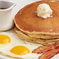 Buttermilk Pancakes & Eggs  · Two cakes, whipped butter, farm fresh Amish eggs any style, choice of meat.