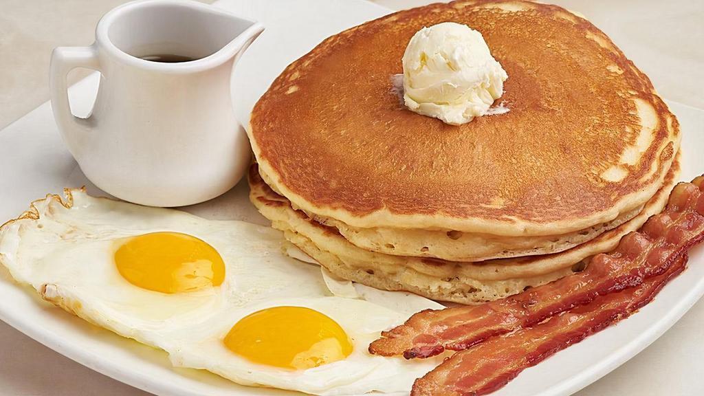 Buttermilk Pancakes & Eggs  · Two cakes, whipped butter, farm fresh Amish eggs any style, choice of meat.