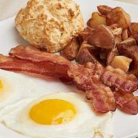 The American Favorite · Farm fresh Amish eggs any style, choice of breakfast meat.