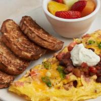California Omelette · Eggbeaters, chicken, tomato, jack cheddar, scallions, baja black bean salsa, cilantro sour c...