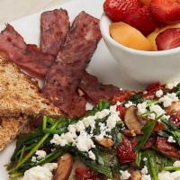Power Breakfast · Egg whites topped with cremini mushrooms, spinach, roasted tomatoes, feta cheese, turkey bac...