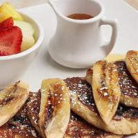 Quinoa Coconut Pancakes · Blueberries, pecans, grilled bananas, strawberries and fruit, agave.  Gluten Free.