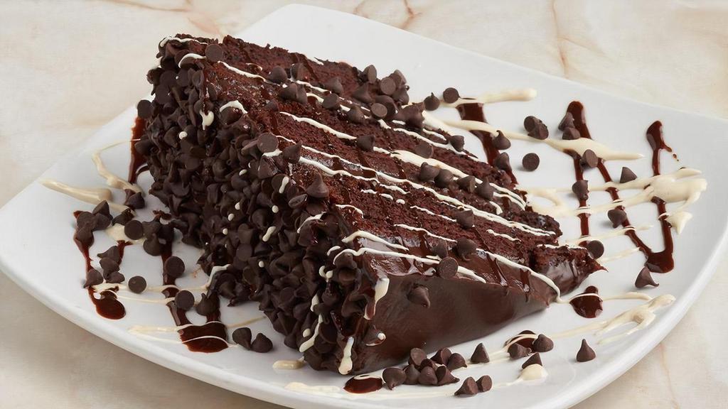 Double Chocolate Triple-Layer Cake · A chocolate lover’s dream! Drizzled with vanilla and dark chocolate.