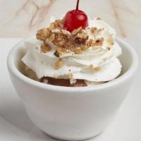 World'S Smallest Sundae · One scoop of all natural Breyer's ice cream with whipped cream, walnuts and your choice of t...