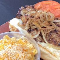 Ribeye Sandwich  · 6oz USDA Ribeye steak served on an open faced hogie bun with grilled onions mayo lettuce  an...