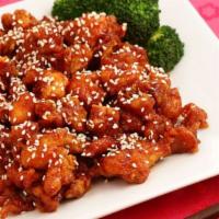 Ding How Sesame Chicken · Crispy white meat chicken sautéed with house sesame sauce, steamed broccoli, and carrots. Se...