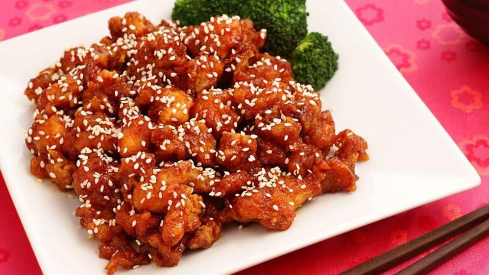 Ding How Sesame Chicken · Crispy white meat chicken sautéed with house sesame sauce, steamed broccoli, and carrots. Served with soup, salad, and rice.