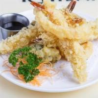 Shrimp Tempura Appetizer (4) · Four pieces battered and fried shrimp and vegetables.