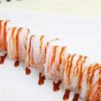Dancing Roll · Shrimp tempura, cream cheese, and avocado. Wrapped in soy paper and topped with fresh crab m...