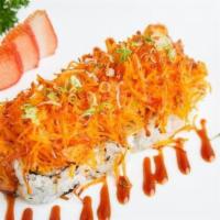 Dynamite Roll · Crab meat, cucumber, and avocado topped with baked fish, masago, scallions, mayo, and specia...