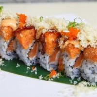 Ocean Roll · Spicy. Seared salmon, crab meat, white tuna, and cucumber topped with spicy tuna, crunchy, m...