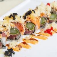 Lonely Angel Roll · Seared pepper tuna with asparagus tempura. Rolled in seaweed and topped with fresh tuna, sal...