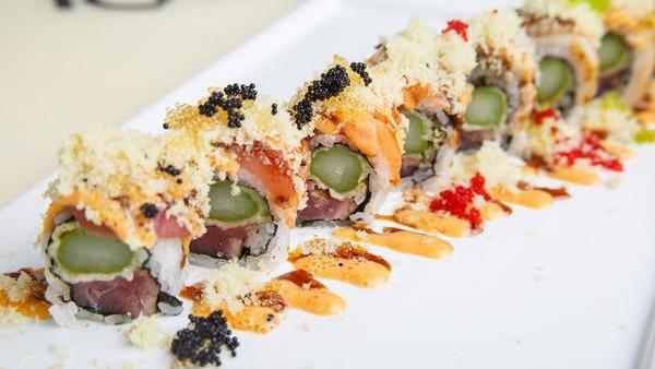 Lonely Angel Roll · Seared pepper tuna with asparagus tempura. Rolled in seaweed and topped with fresh tuna, salmon, eel, and sprinkled with tobiko and chef's special sauce. No Substitutions.