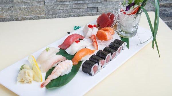 Sushi & Sashimi Combo · Six pieces of chef's choice assorted sashimi, six pieces of sushi, and one tuna roll. Served with your choice of soup or salad. No substitutions.