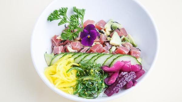 Poke Sushi Bowl · Your choice of protein with avocado, ponzu sauce, and served on a bed of rice with a medley of beets, carrots, radishes, cucumber, and seaweed salad. Served with your choice of soup or salad. No substitutions.