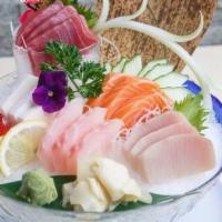 Sashimi Deluxe · Fifteen pieces chef's choice of assorted sashimi. Served with your choice of soup or salad. ...