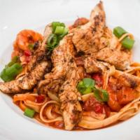 Pasta Jamba-Ya-Ya · Gulf shrimp, chicken & andouille sausage, scallions, peppers, and penne in a spicy creole sa...