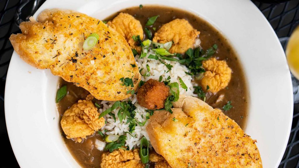 Lagniappe Gumbo Supreme · Gumbo ya-ya topped with heaping’ scoops of jambalaya. Add fried gulf shrimp or buttermilk fried chicken for an additional charge.