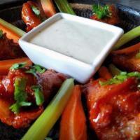 Thai Chicken Wings · Crispy chicken wings coated with homemade thai wings sauce.