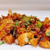 Caulifower Manchurian Dry · Crisp cauliflowers tossed in ginger, garlic, and soy sauce, served dry.
