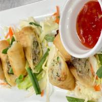 Chicken Dragon Roll · Golden-fried Chinese wraps with savory filling of chicken, vegetables, accompanied with our ...