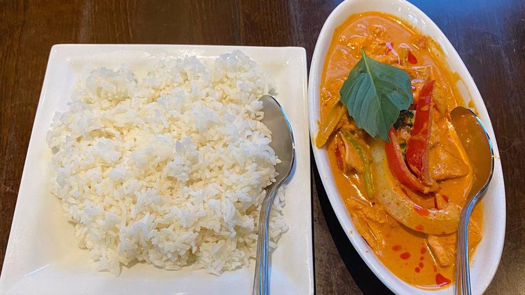 Thai Red Curry Chicken · Red curry paste cooked in coconut milk, chicken & vegetables.