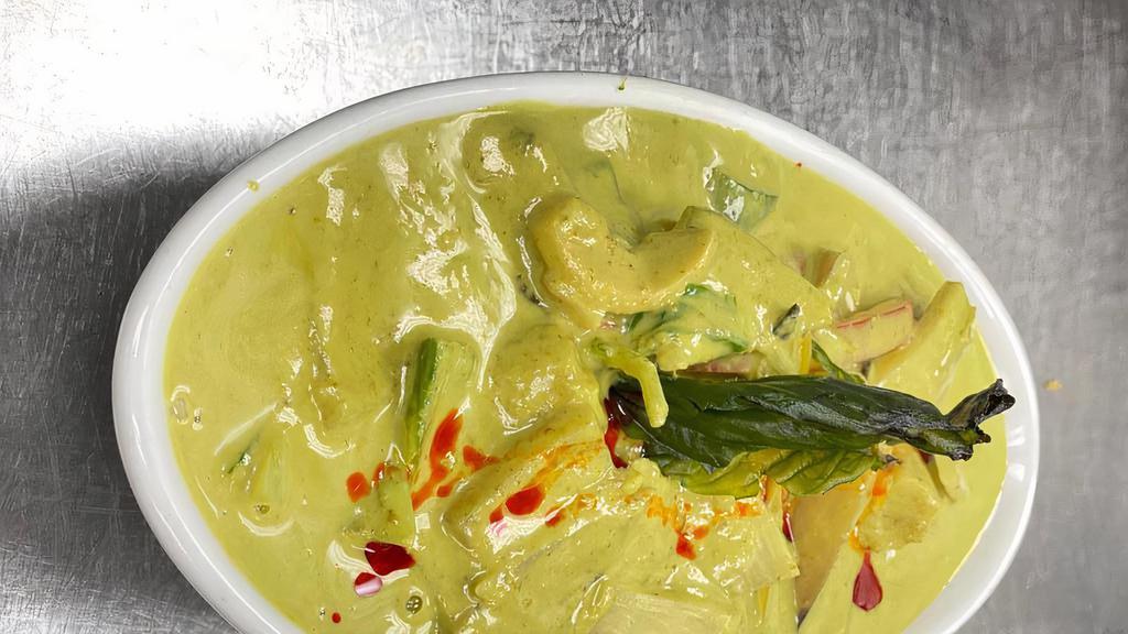 Thai Green Curry Chicken · Green curry paste, coconut milk, palm sugar, kaffir lime leaves, Thai basil, chicken & vegetables.