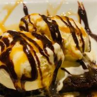 Hot Fudge Brownie Sundae · A “sticky ‘n gooey” Fudge Brownie served with Vanilla Ice Cream, hot fudge sauce, and whippe...