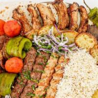 Family Plates · 3 chicken kabob, 3 shish kabob, 3 kufta kabob, hummus, baba ghanoush, tabouli and salad. Kib...