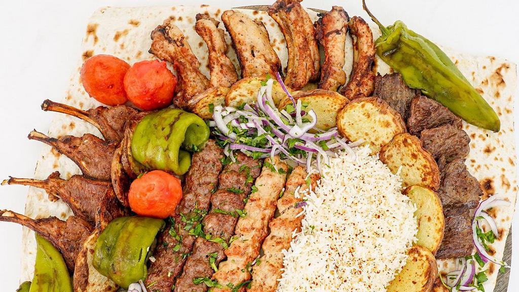 Family Plates · 3 chicken kabob, 3 shish kabob, 3 kufta kabob, hummus, baba ghanoush, tabouli and salad. Kibby, rice and falafel.
